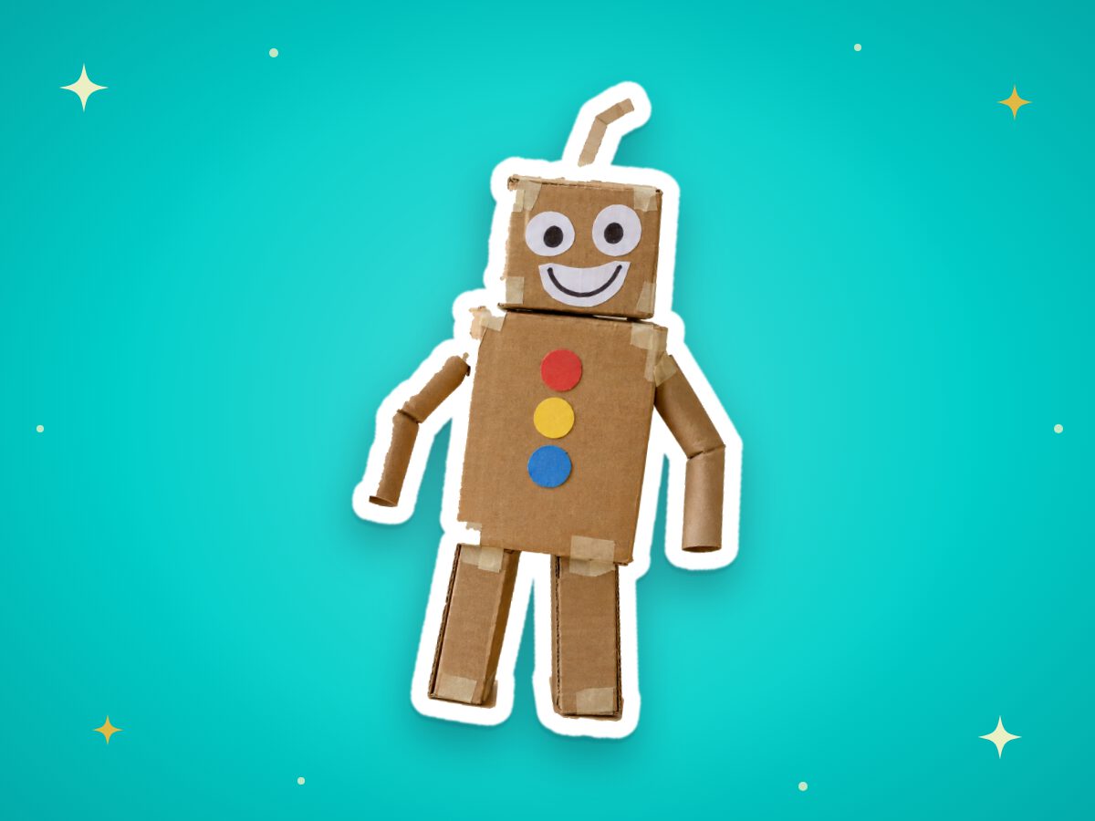 A smiling robot built from cardboard boxes