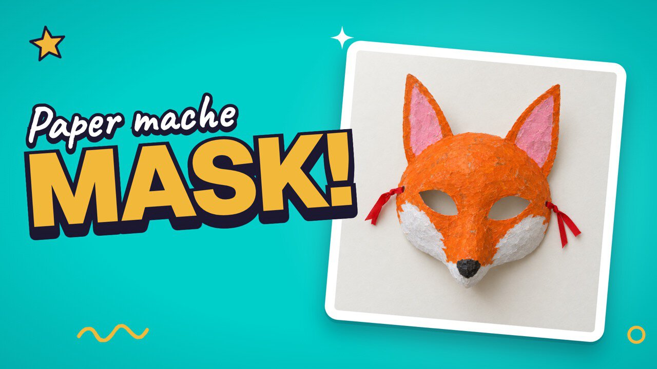 A paper mache fox mask painted orange